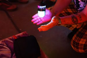 hands around a glowing microphone